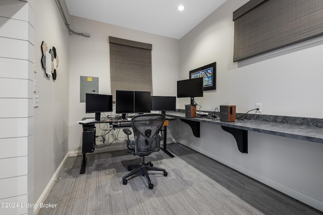 home office featuring electric panel, baseboards, and recessed lighting