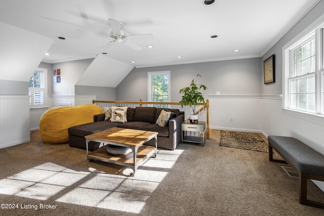 carpeted living room with a wainscoted wall, ornamental molding, lofted ceiling, and recessed lighting