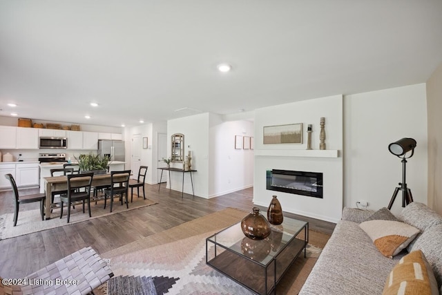 living room with dark hardwood / wood-style floors