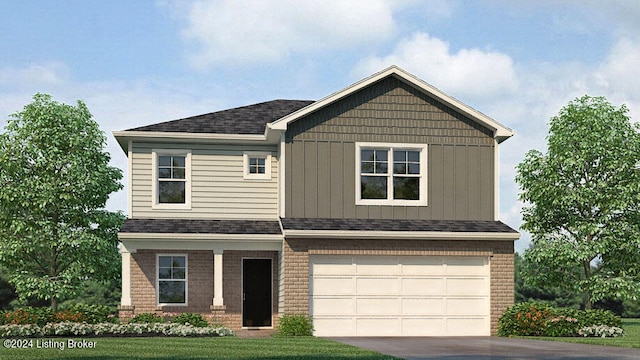 view of front of home with a garage and a front yard