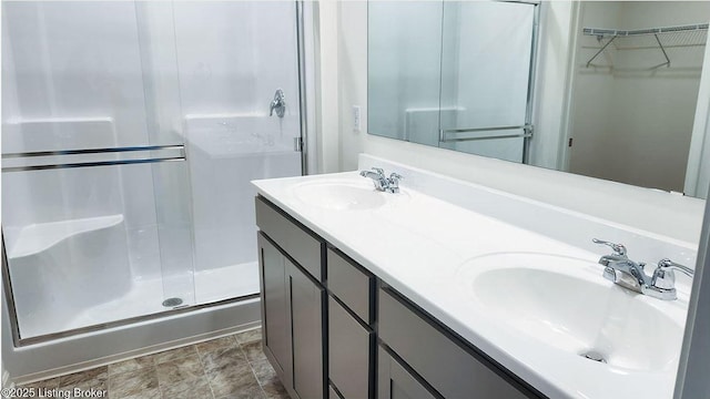 bathroom featuring vanity and walk in shower