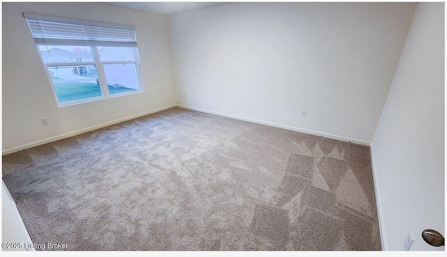 spare room with carpet flooring