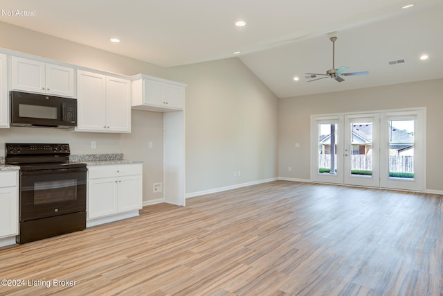 kitchen with light hardwood / wood-style flooring, vaulted ceiling, light stone countertops, white cabinets, and black appliances