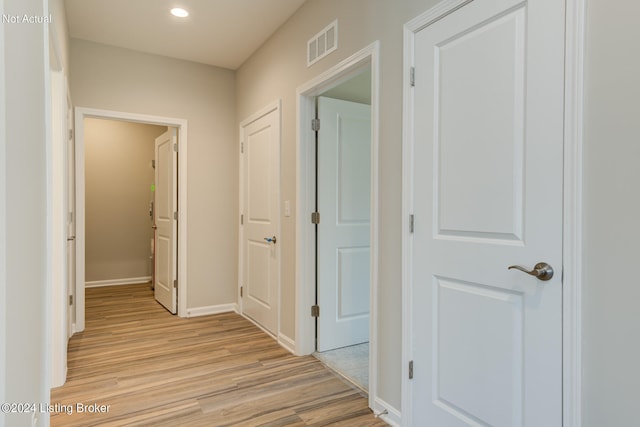 corridor featuring light hardwood / wood-style flooring