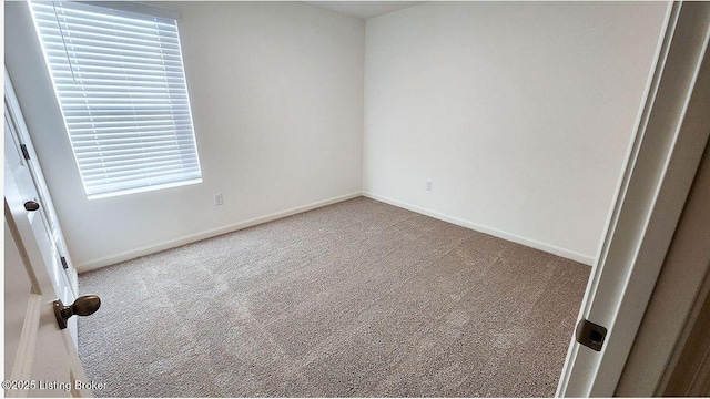 unfurnished bedroom featuring baseboards and carpet floors