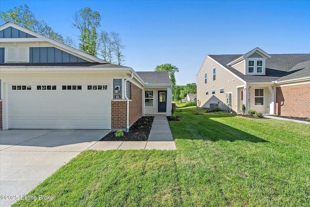 204 Harvest Moon Ct Unit 217B, Shepherdsville, KY 40165 - view of front of property with driveway, board and batten siding, a front yard, an attached garage, and brick siding