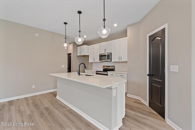 204 Harvest Moon Ct Unit 217B, Shepherdsville, KY 40165 - kitchen featuring stainless steel appliances, a sink, white cabinetry, light wood-style floors, and tasteful backsplash