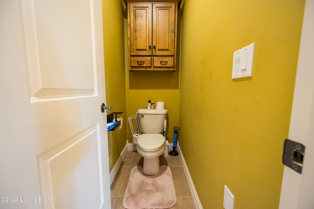 bathroom featuring toilet and tile patterned floors