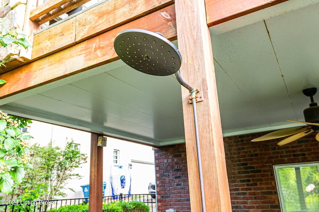 exterior details featuring ceiling fan