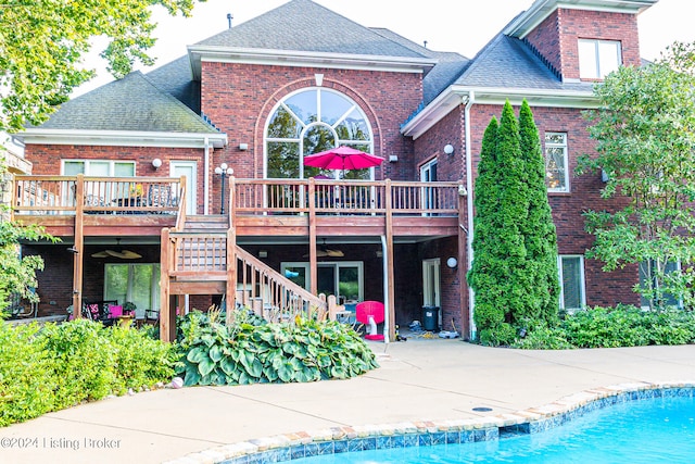 back of house with a patio area and a pool side deck