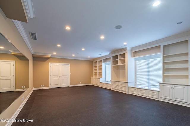 unfurnished living room with built in features and crown molding