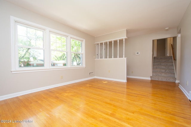 unfurnished room featuring hardwood / wood-style floors