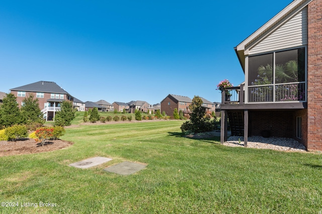 view of yard with a sunroom