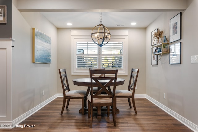 dining space featuring an inviting chandelier and dark hardwood / wood-style floors