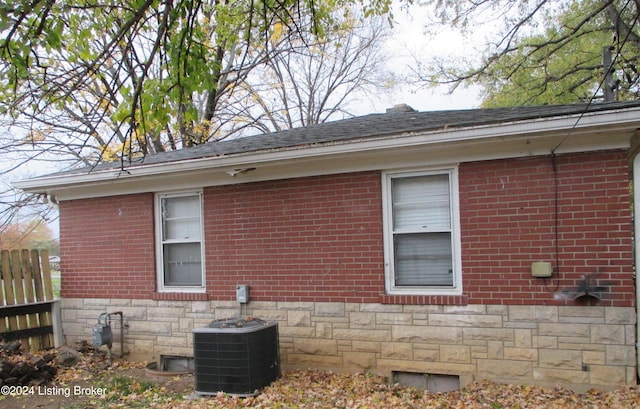 view of side of property with central AC unit