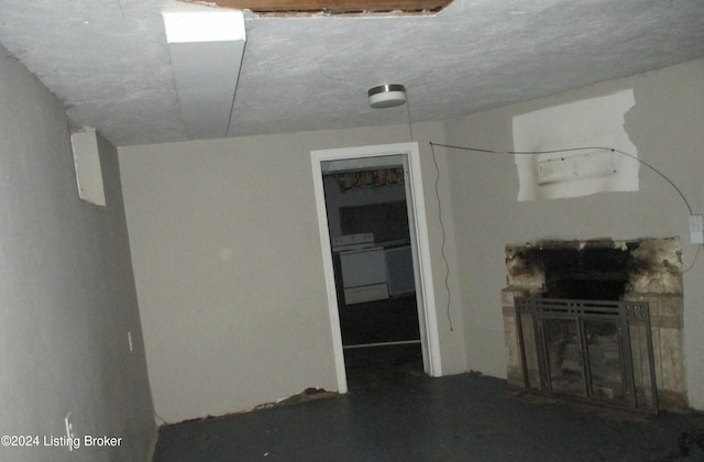 unfurnished living room featuring washer / clothes dryer