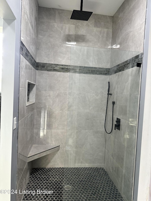 bathroom with tiled shower