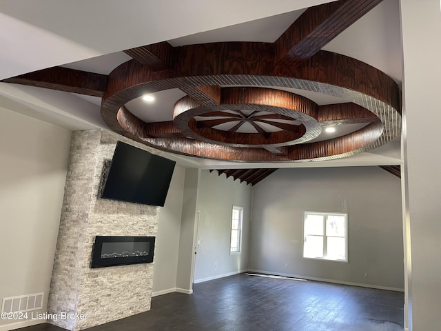 unfurnished living room with a fireplace and dark hardwood / wood-style floors