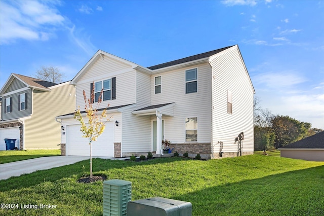 front facade with a garage and a front lawn