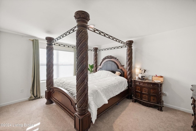 bedroom with light colored carpet