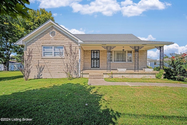 view of front of home with a front lawn and a porch