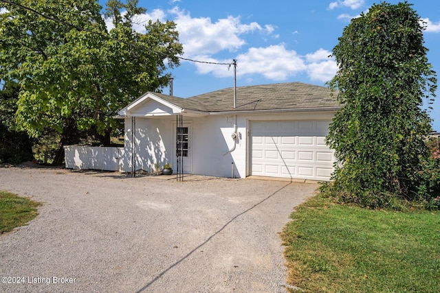 single story home with a garage