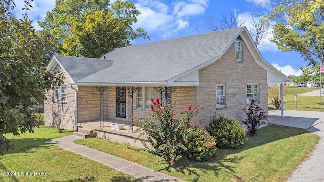 view of front of house featuring a porch and a front yard