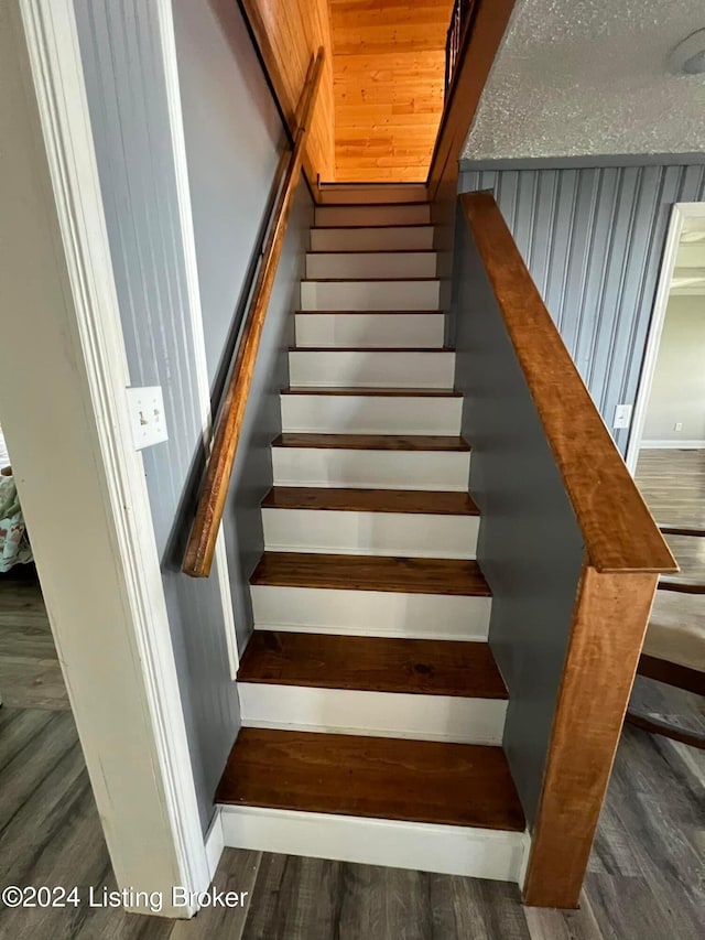 stairway featuring hardwood / wood-style floors