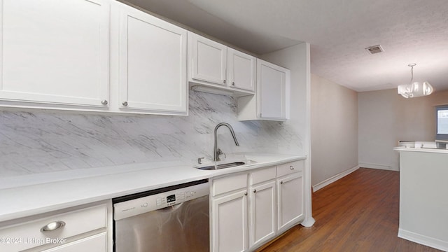 kitchen featuring pendant lighting, white cabinetry, dishwasher, dark hardwood / wood-style floors, and an inviting chandelier