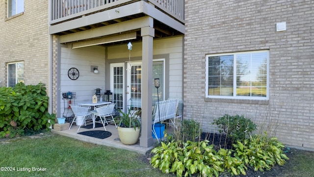 doorway to property featuring a balcony and a patio area