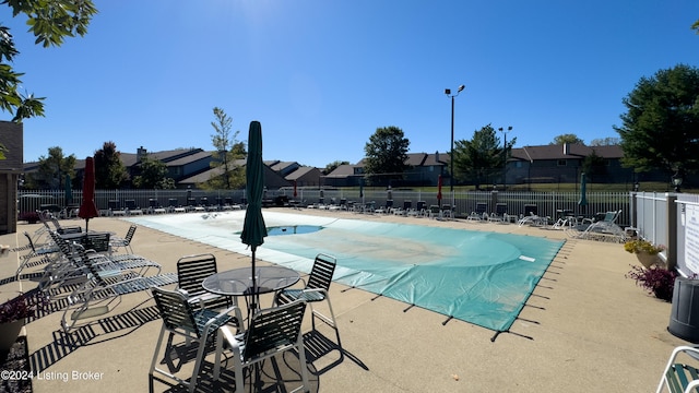 view of swimming pool with a patio area