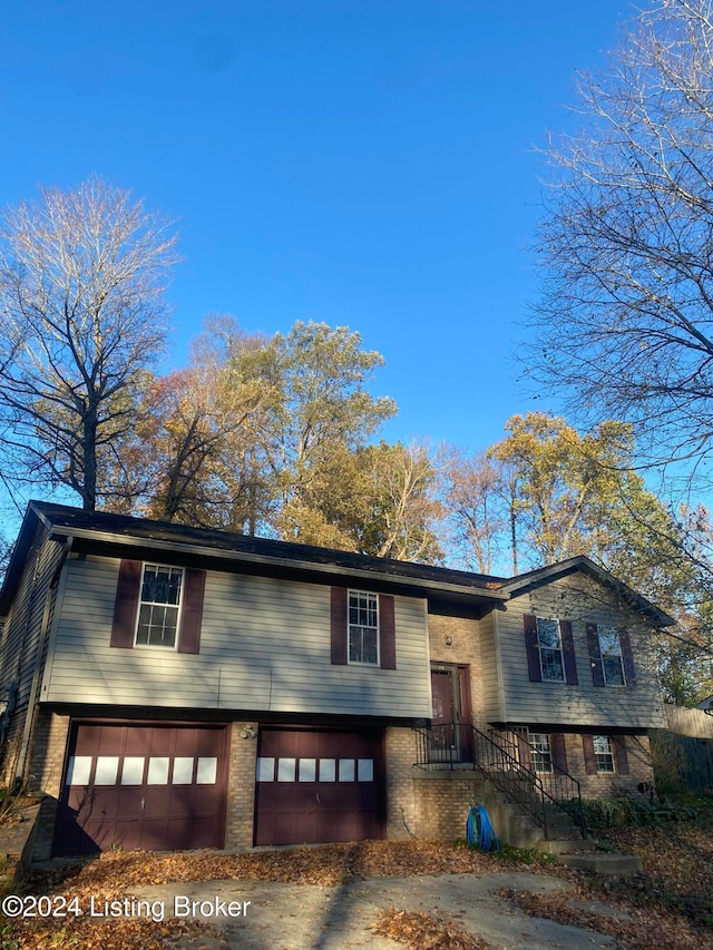 raised ranch featuring a garage