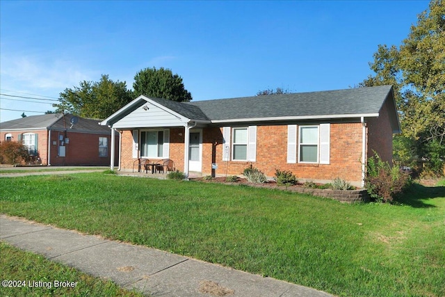 single story home with a front lawn