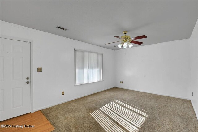 spare room with ceiling fan and hardwood / wood-style floors