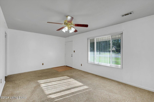 spare room with ceiling fan and carpet floors