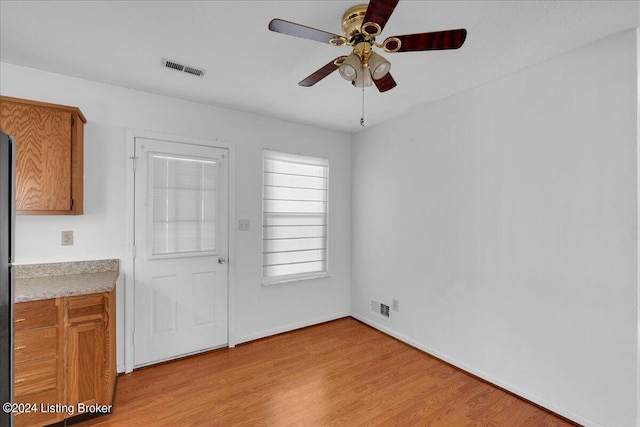 interior space featuring light wood-type flooring and ceiling fan