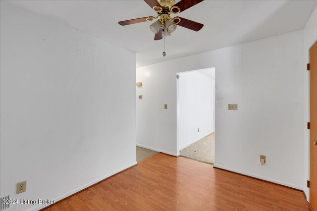 unfurnished room featuring ceiling fan and hardwood / wood-style flooring