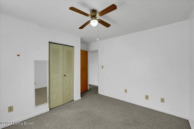 unfurnished bedroom featuring a closet, carpet, and ceiling fan