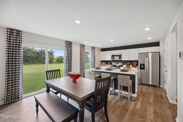 dining area with hardwood / wood-style floors