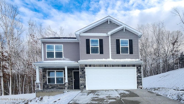 170 Coral Ridge Way, Brooks, KY 40109 - view of front facade featuring a garage, driveway, stone siding, and covered porch