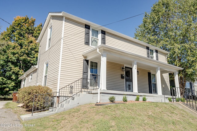 view of front of home with a front lawn and a porch