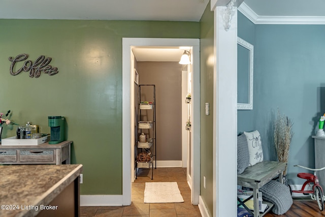 bathroom with crown molding and tile patterned floors