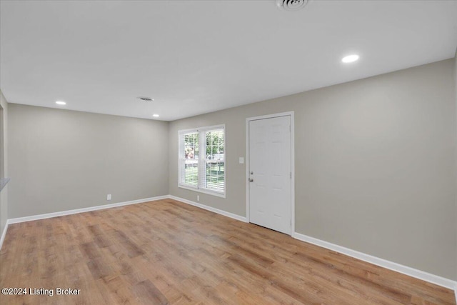 empty room with light hardwood / wood-style floors