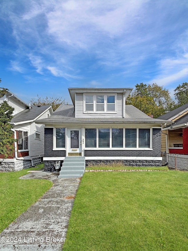 view of front of home with a front yard