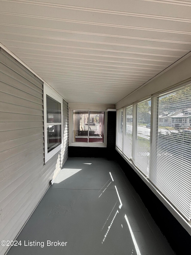 unfurnished sunroom with a wealth of natural light