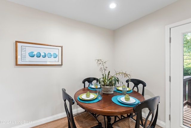 dining room with hardwood / wood-style flooring