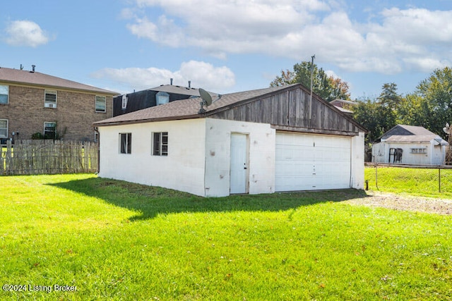 garage with a lawn