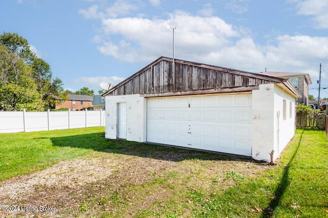 garage with a lawn