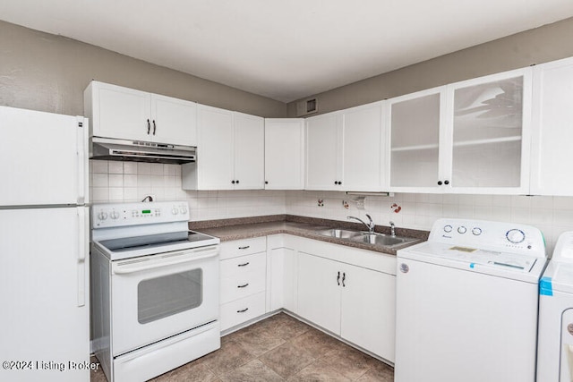 kitchen featuring decorative backsplash, white cabinets, white appliances, sink, and tile patterned floors