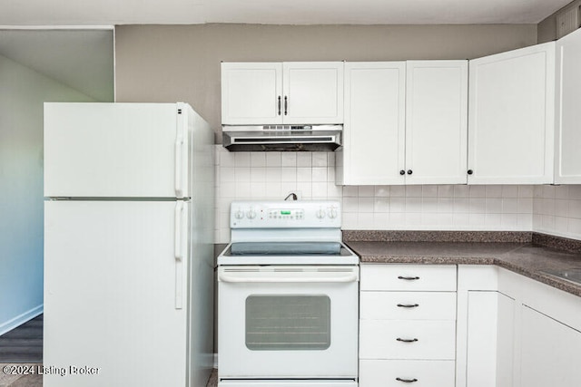 kitchen featuring decorative backsplash, white appliances, and white cabinetry